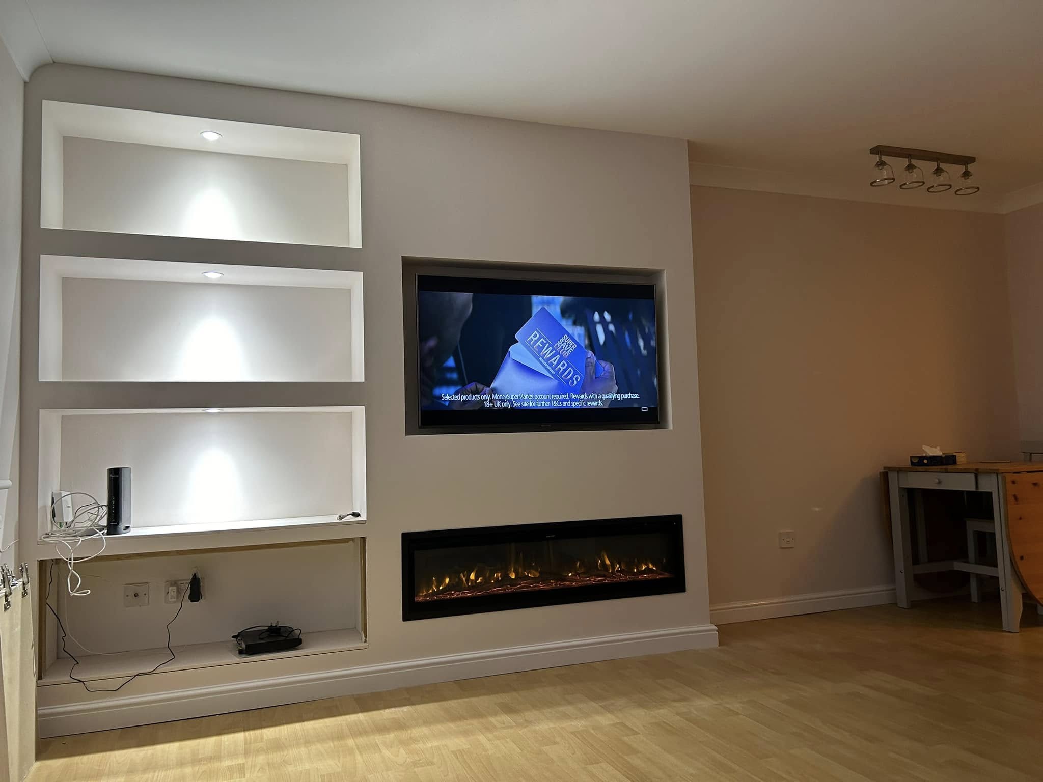 after joinery media wall shelving.webp